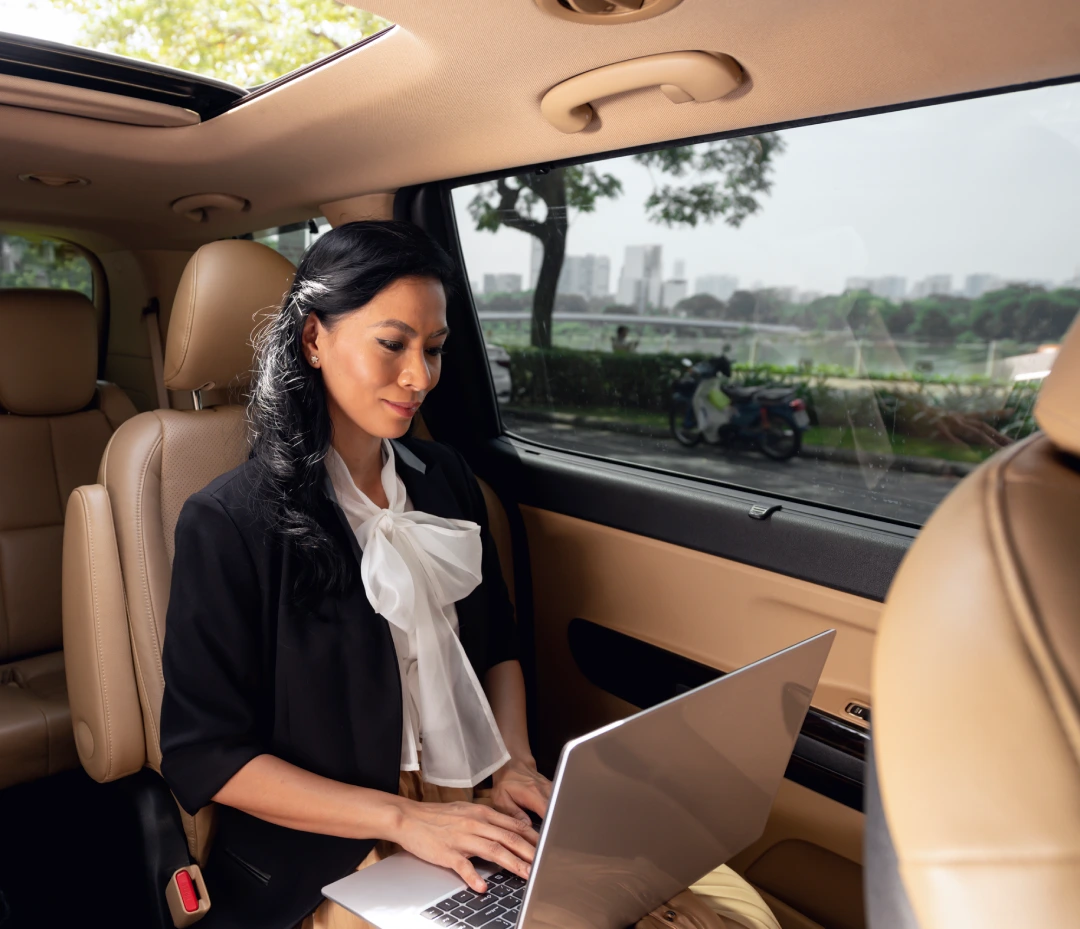Businesswoman Sitting Backseat Chauffeur Service